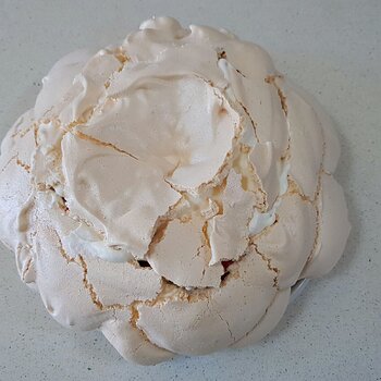 Pavlova filled with the top reassembled
