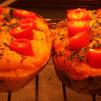 Stuffed jacket potatoes with fresh cayenne chillis.