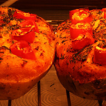 Stuffed jacket potatoes with fresh cayenne chillis.