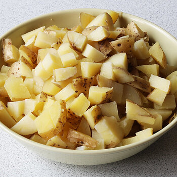 Potatoes, scrubbed, boiled and cubed.