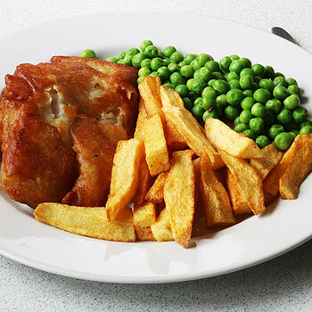 Battered pollock, chips and peas.