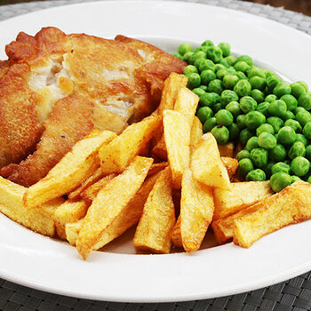 Battered pollock, chips and peas.
