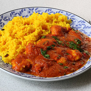 With aromatic yellow rice.