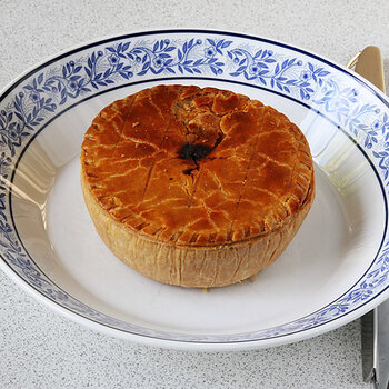 Steak and kidney pie browned.