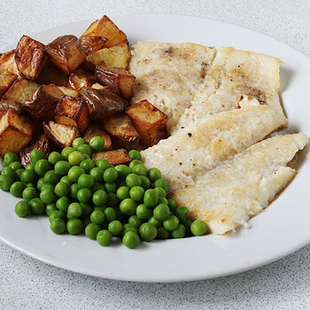 Halibut with roast potatoes and peas.