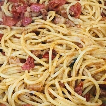 Spaghetti with cherry tomatoes, black garlic, guanciale, pecorino