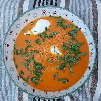 Tomato soup with poached eggs