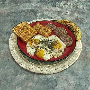 Eggs, Sausage, Toast with Orange Tangerine Preserve, a Hash Brown Patty and a Banana