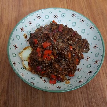 Chilli con fungi over a baked potato