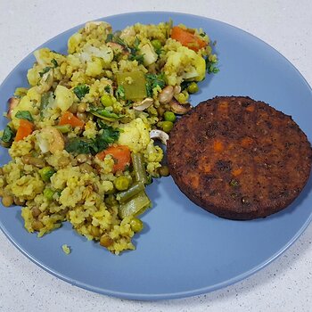 Cauliflower & Pea Khichari with a vegetable burger