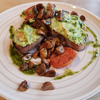 Mashed Avo on Sourdough with fried mushrooms, fried tomatoes & vegan pesto