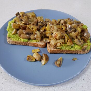 Smashed Avo, fried mushrooms and onions on toast