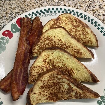 french toast made with Brioche and Bacon on the side