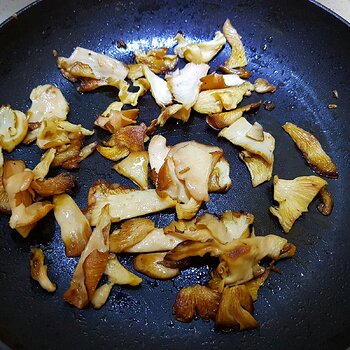 Pink oyster mushrooms cooking