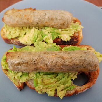 Vegan Chicken 'sausage' on smashed Avo on sourdough toast