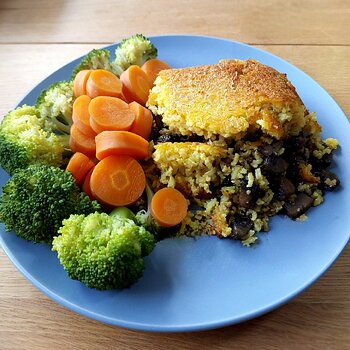 Tahchin - stuffed with herby mushrooms, served with broccoli and carrots