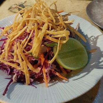 BRAZILIAN COLESLAW lime dressing, charred corn, cabbage, crisp tortilla