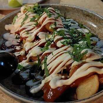 POTATAS BRAVOS aioli, smoked tomato, fermented chili