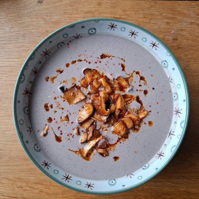 Marinated Mushrooms served in a raw mushroom soup base