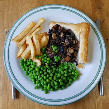 Mushroom Tart with chips and peas
