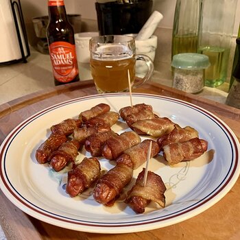 Bacon-Wrapped Sausages Brushed In Maple-Sugar Glaze