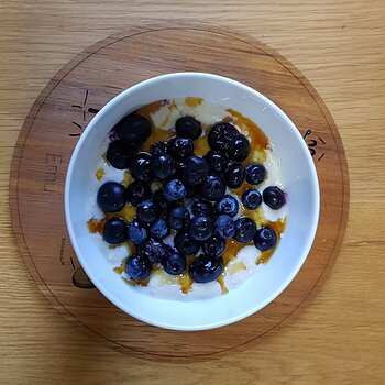 Blueberries and maple syrup with soya yoghurt soaked oats