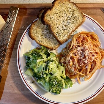 Pasta, Red Sauce, Broccoli, And Garlic Toast