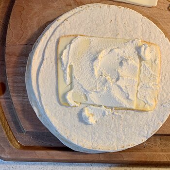 Add cheeses to tortillas...