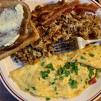 Omelette, Shredded Potatoes, Bacon, And Toast