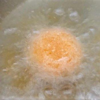 Deep-frying breaded egg yolk.jpg