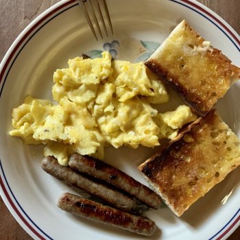 Scrambled Eggs With Cheese And Sausages