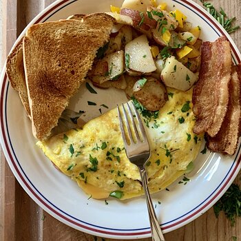 Omelette, Potatoes, Bacon, And Toast