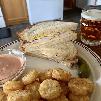 Peppered Deli Chicken Sandwich, Crispy Crown Potatoes, Pickle, And Beer