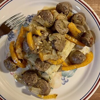 Sausage, Peppers, And Onions Over Broiled Polenta