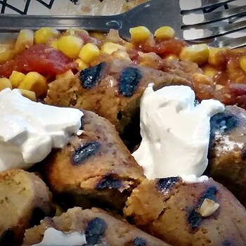 vegan-grilled-sausage-closeup-on-plate-sour-cream.jpg