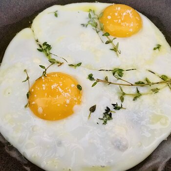 Fried Eggs topped with thyme and Parmigiano.jpeg