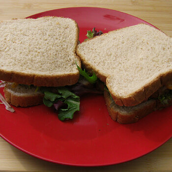 Breaded Chicken Sandwiches with Bacon and Cheese over Lettuce with Habnero Salsa