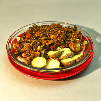 Braised Berbere Pork with Quinoa over Cabbage