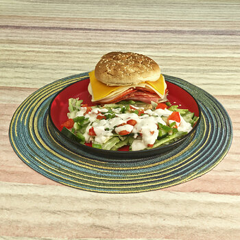 Stacked Cold Cuts and Cheese Sandwich with a Layered Salad