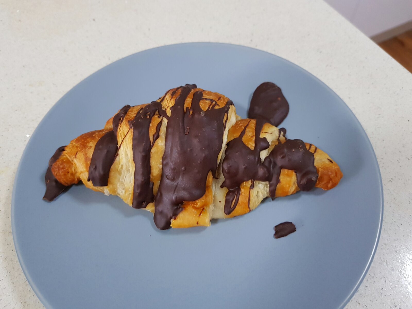 A slightly battered vegan chocolate croissant