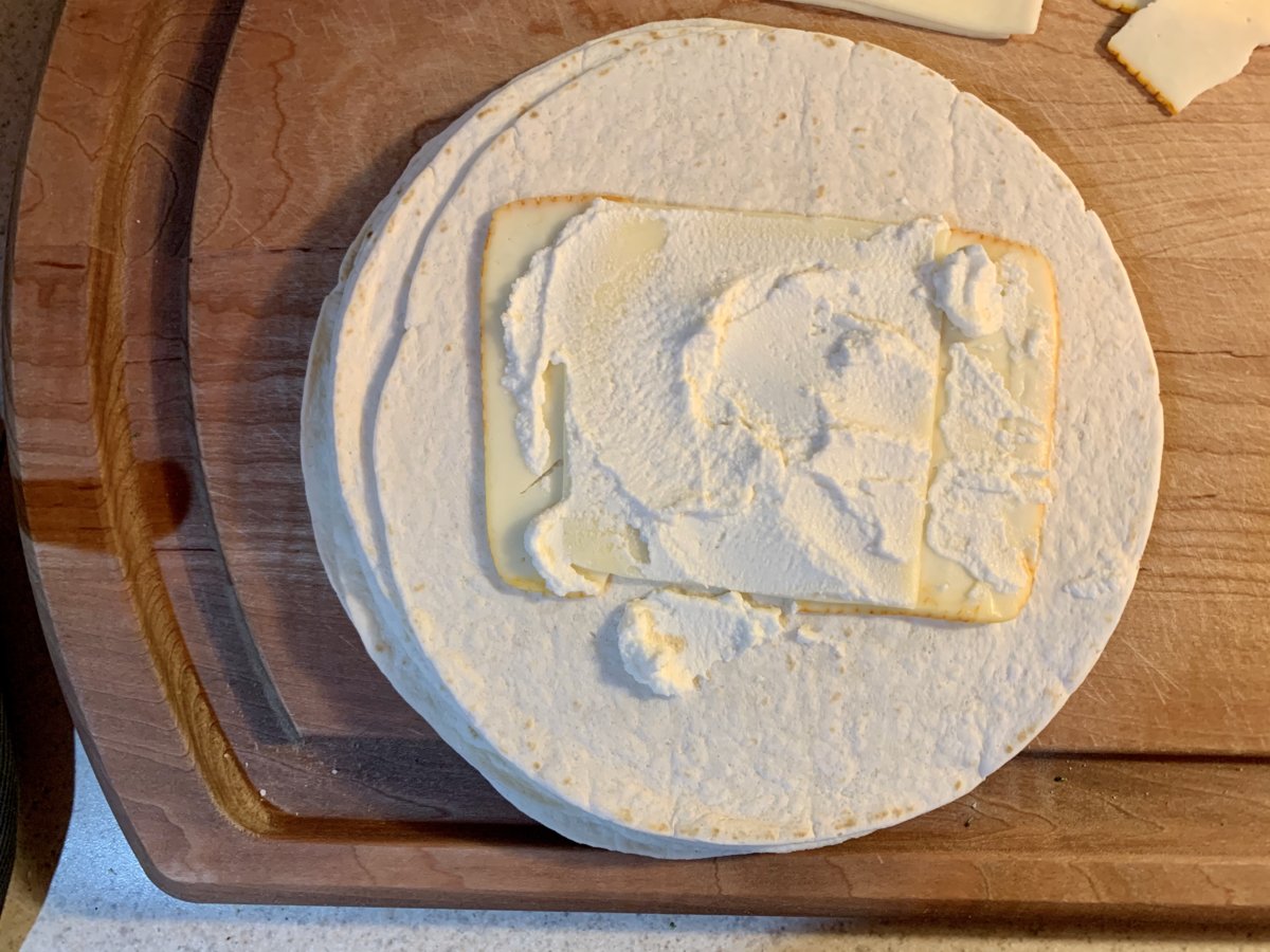 Add cheeses to tortillas...