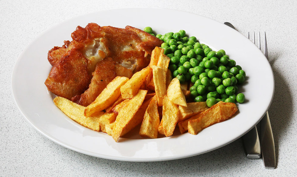 Battered pollock, chips and peas.