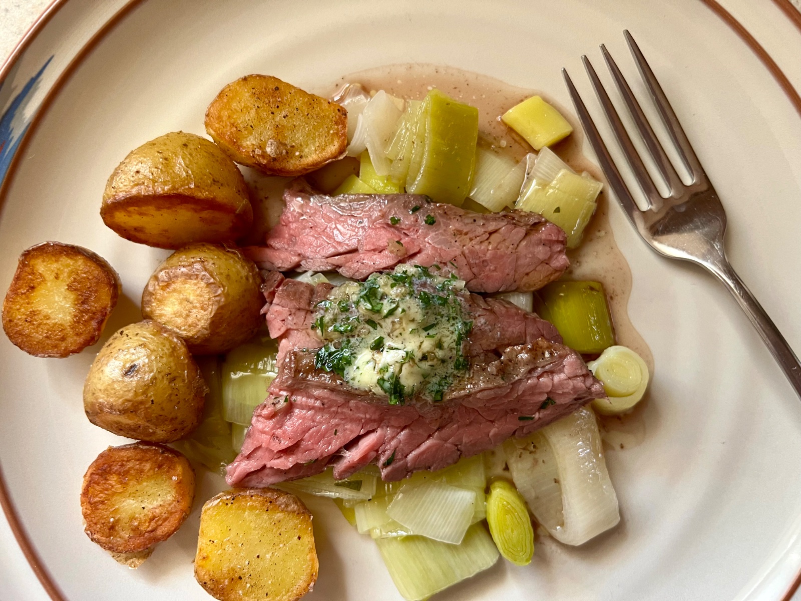 Broiled Skirt Steak w/ Garlic-Brandy Butter, Sautéed Leeks, and Pan-Fried Potatoes