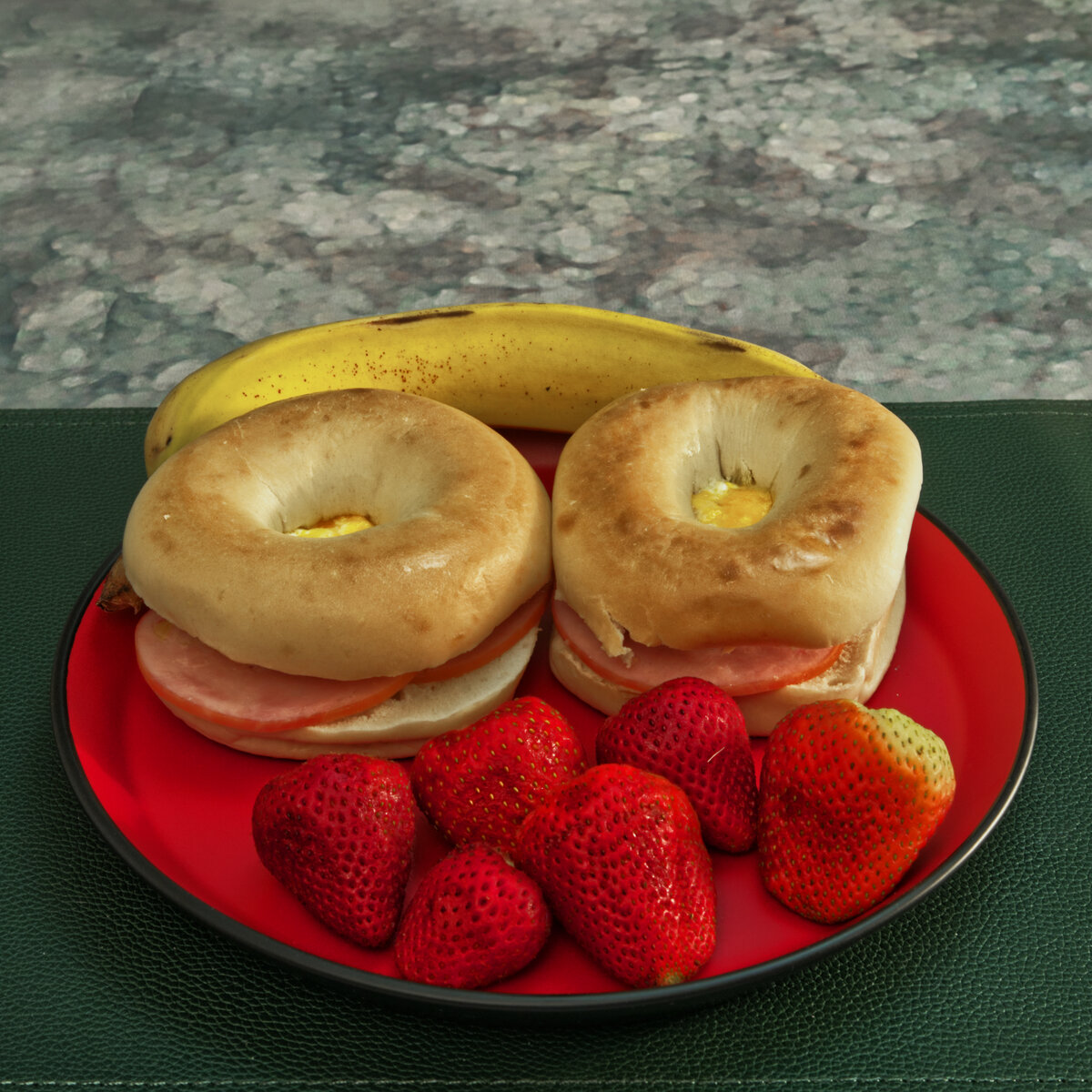 Canadian Bacon and Egg Bagles with Strawberries and a Banana
