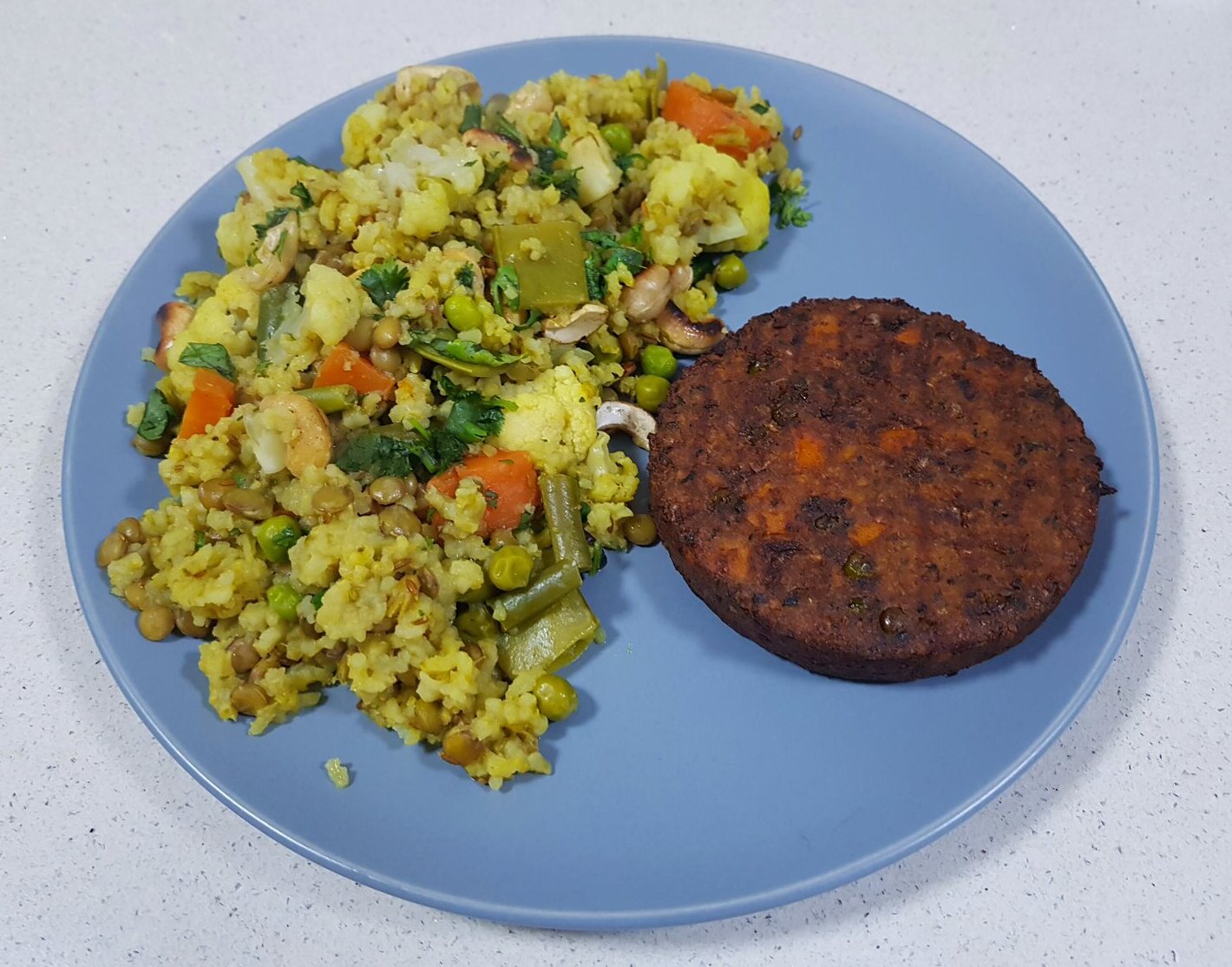 Cauliflower & Pea Khichari with a vegetable burger