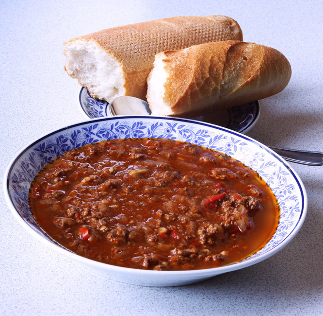 Chilli con carne with small baguette.