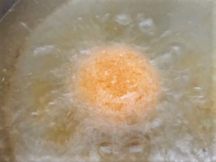 Deep-frying breaded egg yolk.jpg