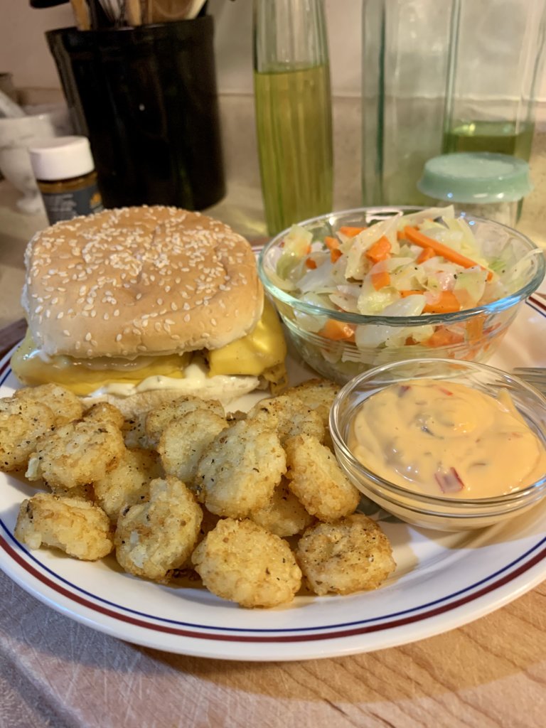 Fish Sandwich, Crispy Crowns, And Steamed Cabbage And Carrots