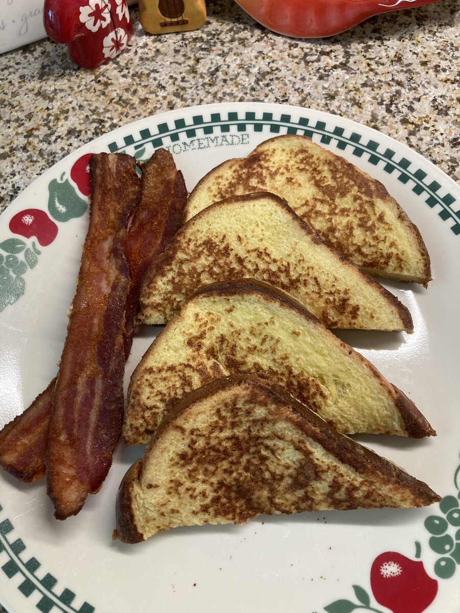 french toast made with Brioche and Bacon on the side