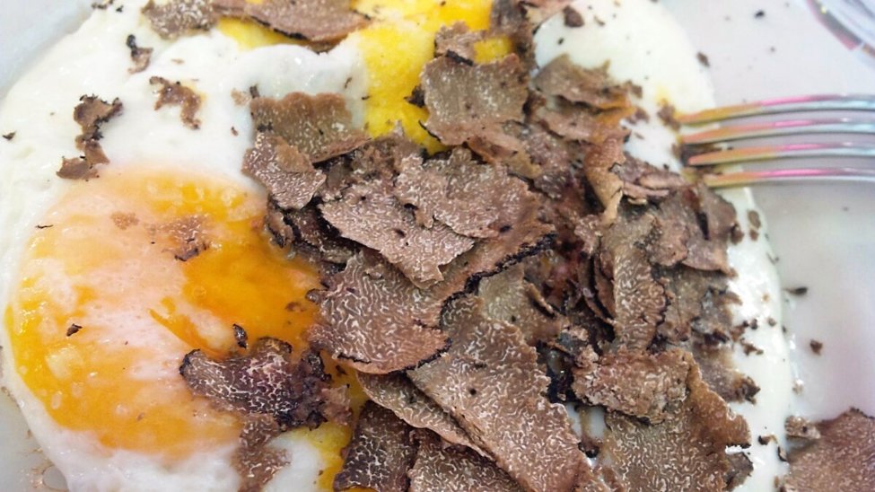 Fried eggs and black truffle carpaccio